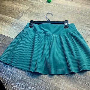 Green tennis skirt with built-in shorts